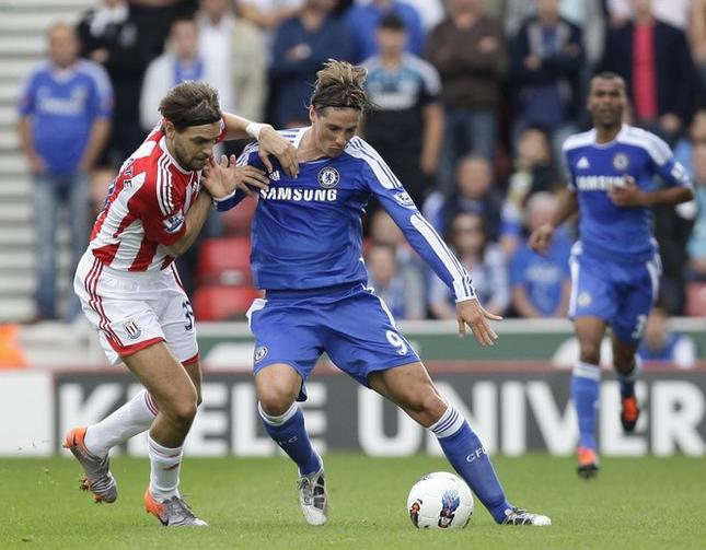 Stoke City's Jonathan Woodgate with Chelsea's Fernando Torres