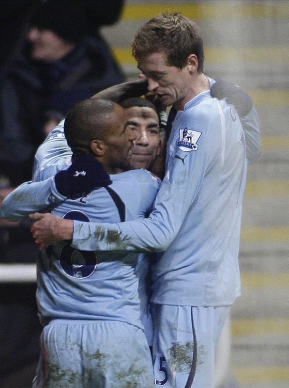 Jermain Defoe & Peter Crouch congratulate Aaron Lennon, St James Park, January 2011