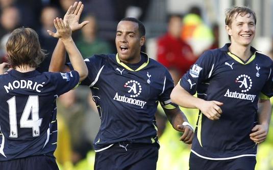 Tom Huddlestone is congratulated by Luka Modric and Roman Pavlyuchenko after scoring the winner at Fulham, October 2010